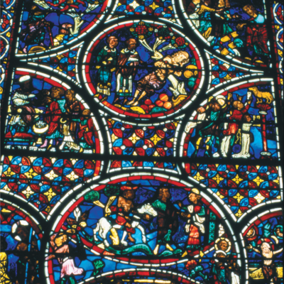 Plate 8. Bourges, lower half of window. Scene 6 depicts the compassion of the Samari­tan, which represents the pure love of Christ. Flanking that scene are scenes 21 and 22, showing the scourging and crucifixion of Jesus. Courtesy George S. Tate.